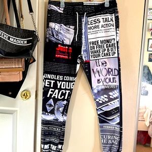 A pair of men joggers with money graphics on them